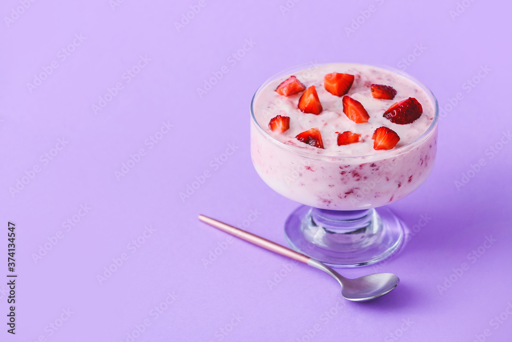 Bowl of strawberry yogurt on color background