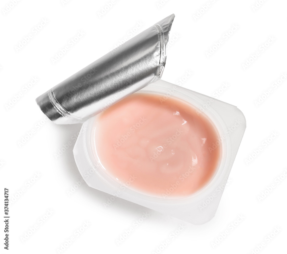 Plastic cup of strawberry yogurt on white background