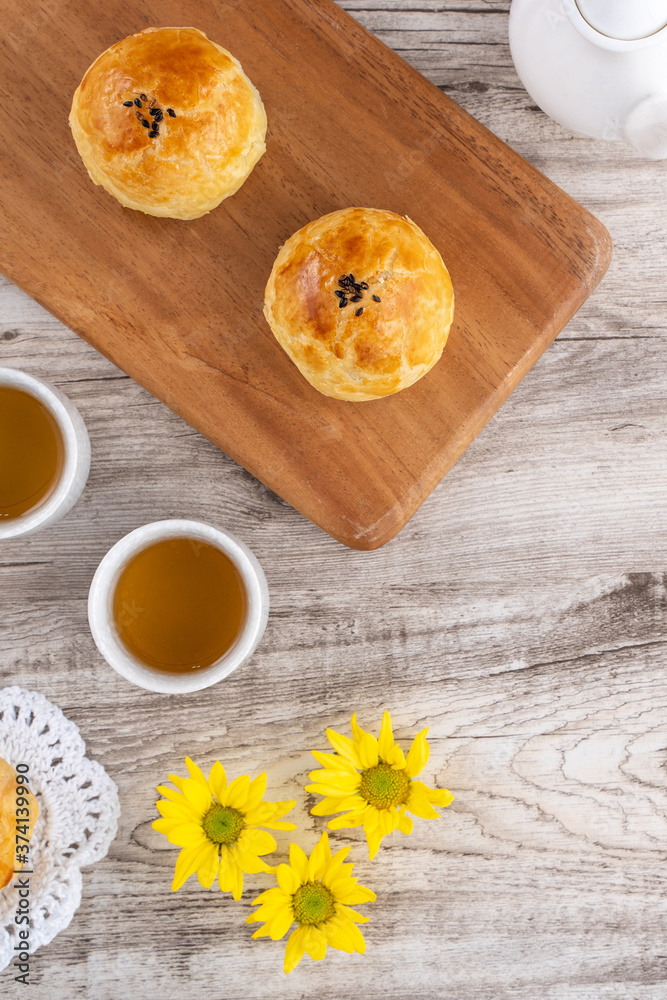 Moon cake yolk pastry, mooncake for Mid-Autumn Festival holiday, top view design concept on bright w