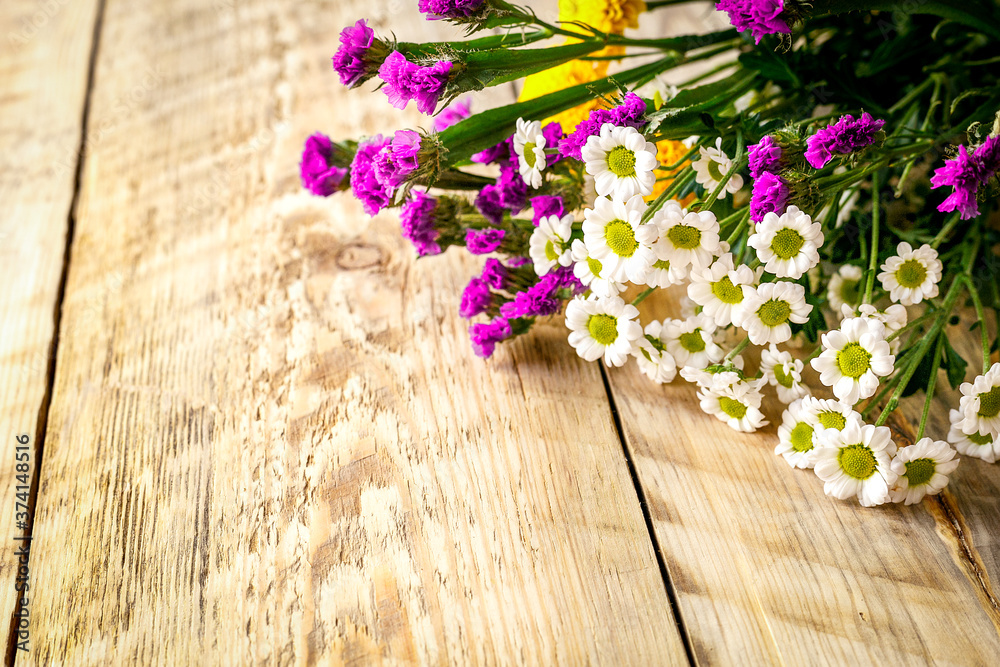 Spring flowers on wooden board