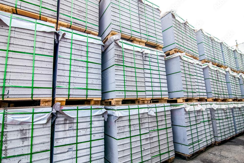 Stack of concrete blocks near house-building factory