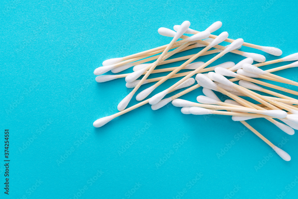 Bamboo swabs on a blue background