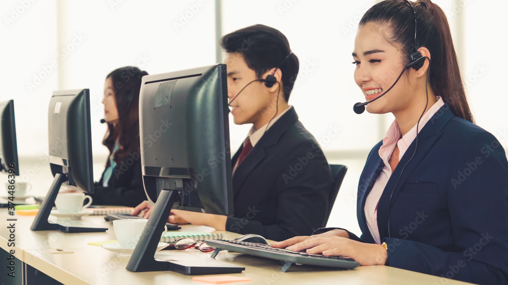 Business people wearing headset working in office to support remote customer or colleague. Call cent