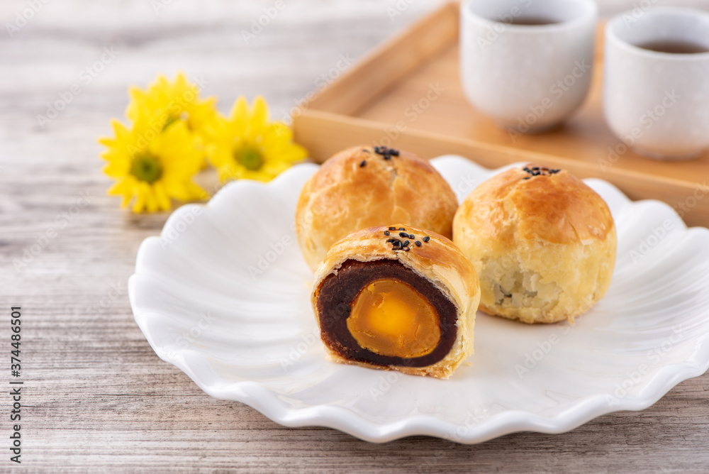 Moon cake yolk pastry, mooncake for Mid-Autumn Festival holiday, top view design concept on bright w