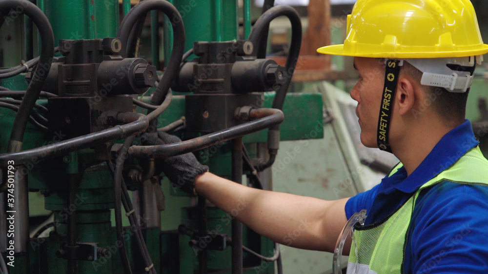 Smart factory worker using machine in factory workshop . Industry and engineering concept.