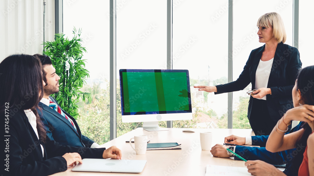 Business people in the conference room with green screen chroma key TV or computer on the office tab