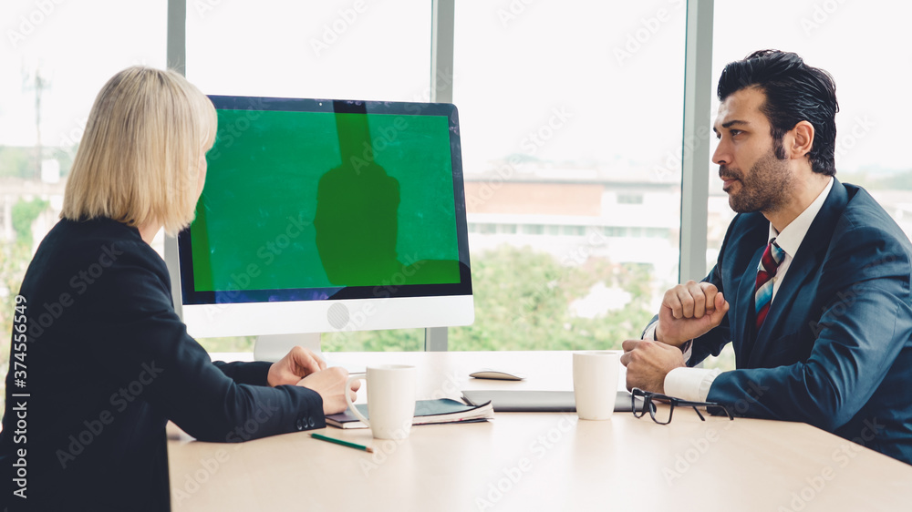 Business people in the conference room with green screen chroma key TV or computer on the office tab