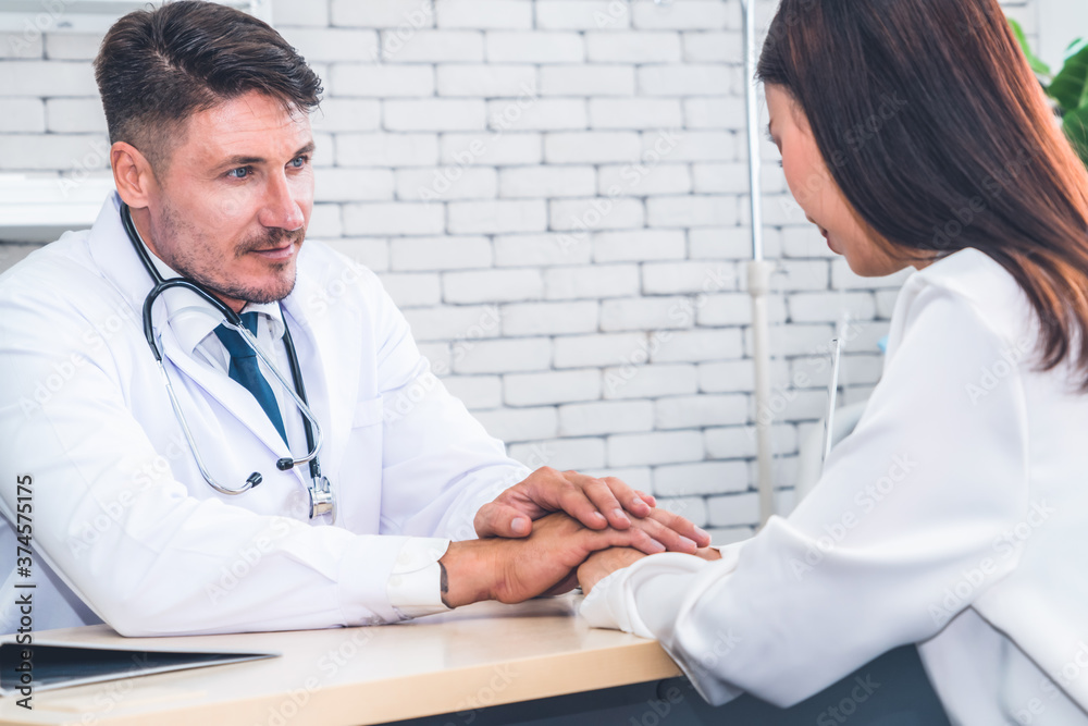 Doctor in professional uniform examining patient at hospital or medical clinic. Health care , medica