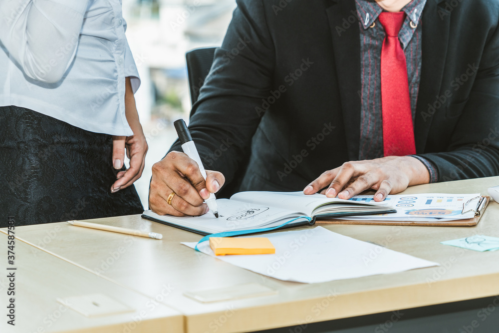 Two business people talk project strategy at office meeting room. Businessman discuss project planni