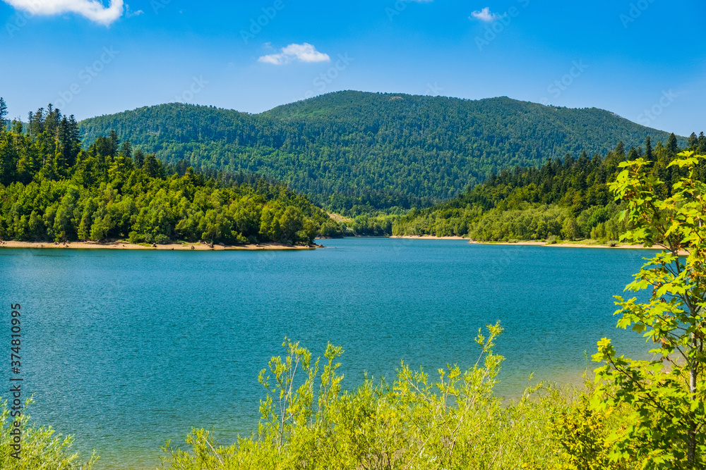 Landscape in Croatia, Gorski kotar, lake Lepenica, green forest and mountains in background