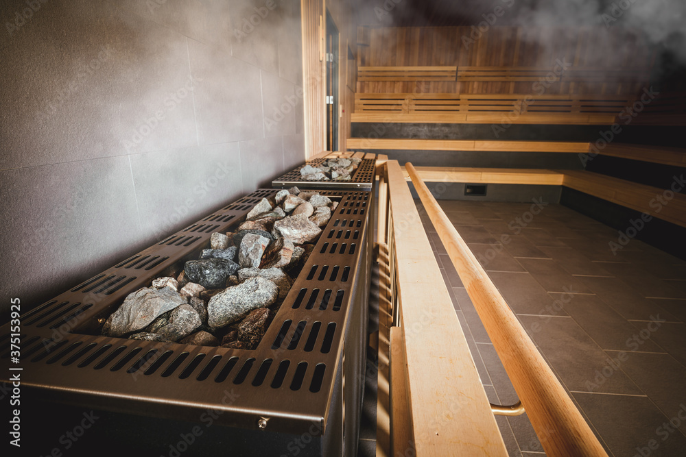 Big heater in Finnish sauna with hot stones