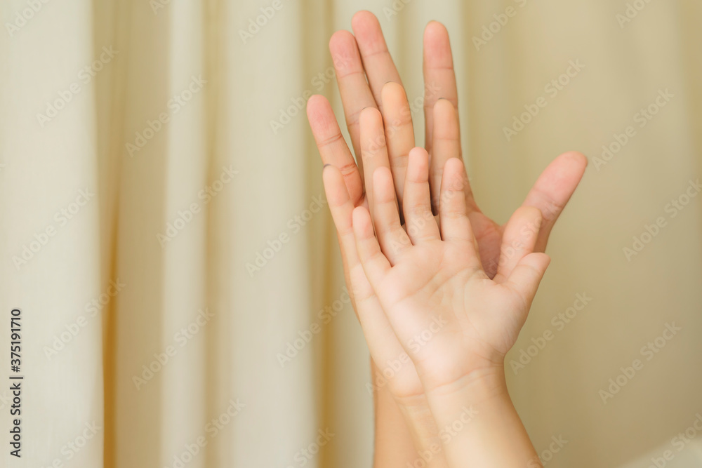 Stack of barehands from father, mother, and son.