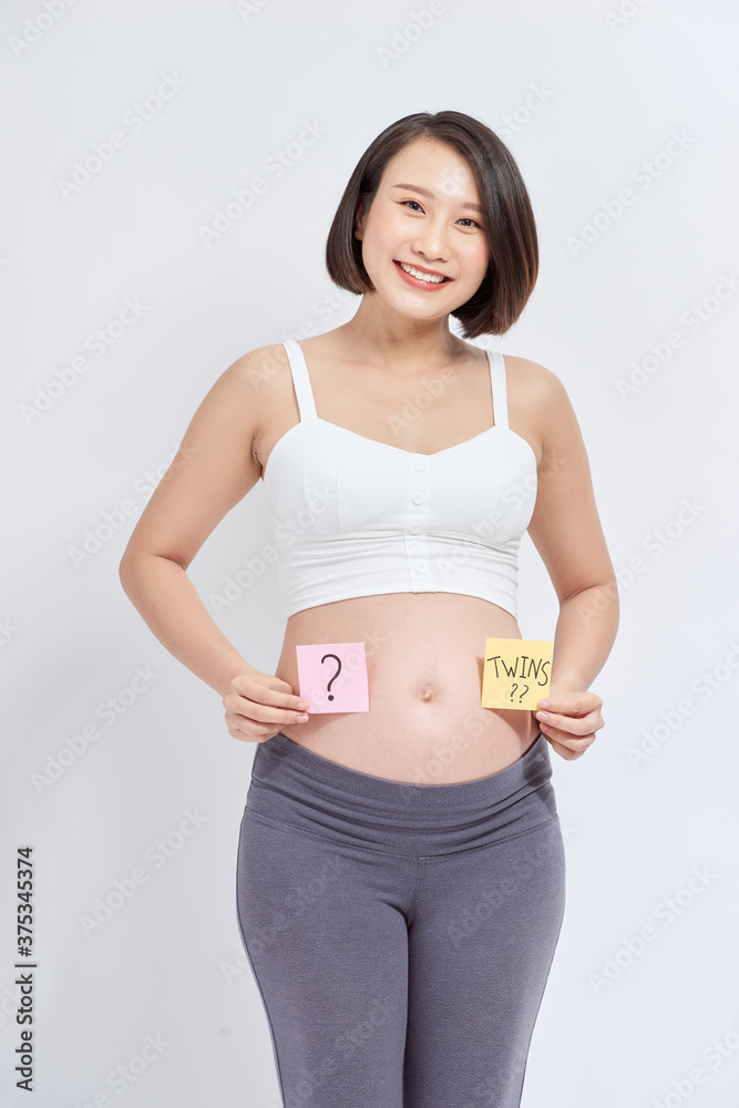 Belly of a pregnant woman with stickers