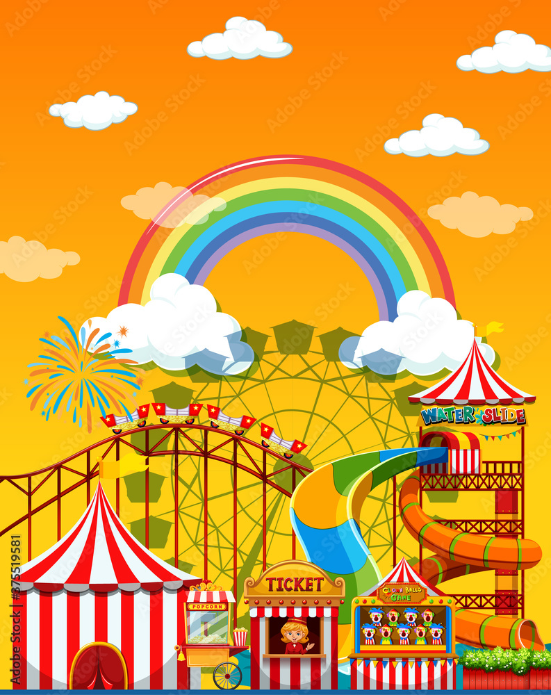 Amusement park scene at daytime with rainbow in the sky