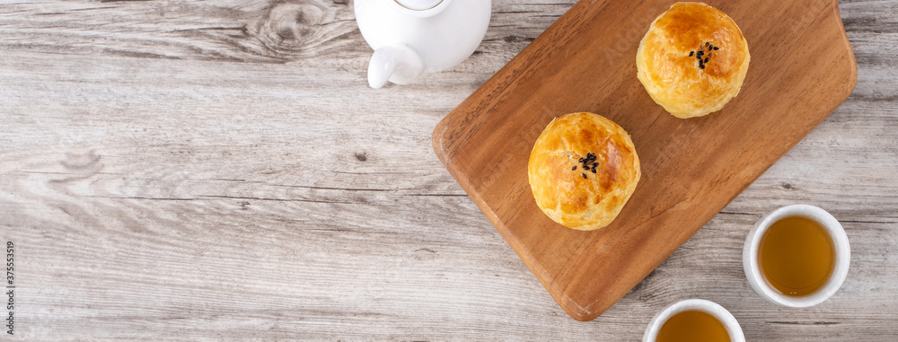 Moon cake yolk pastry, mooncake for Mid-Autumn Festival holiday, top view design concept on bright w