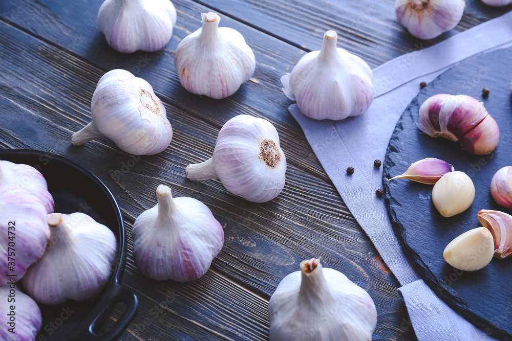 Fresh garlic on wooden background