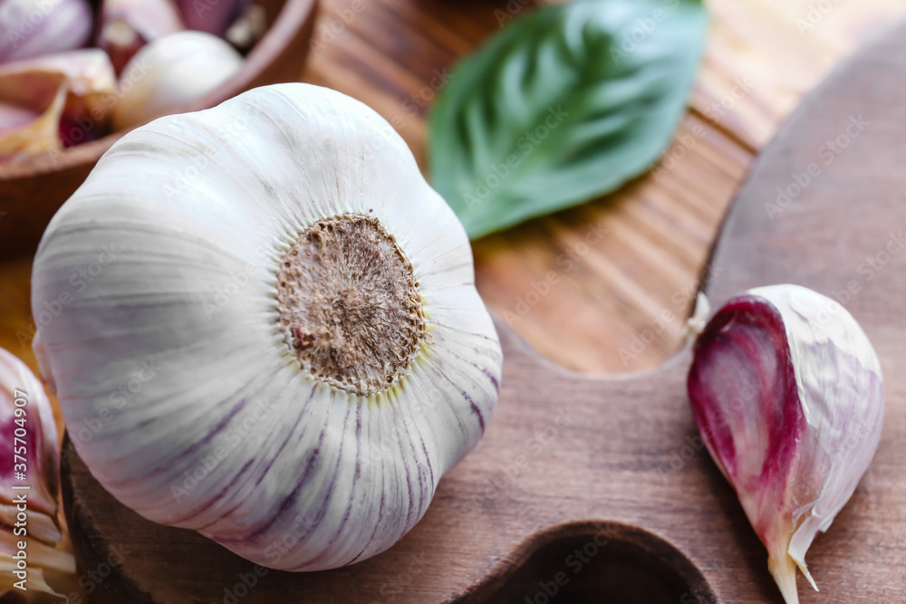 Fresh garlic on wooden background, closeup