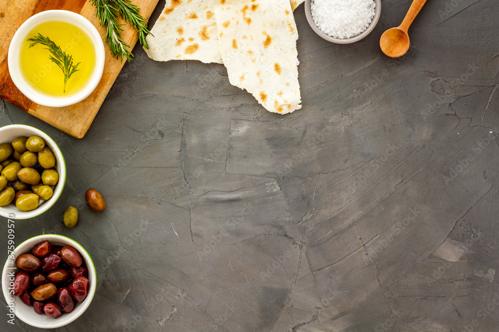 Italian olives, oil, bread - appetizer and snacks - top view copy space