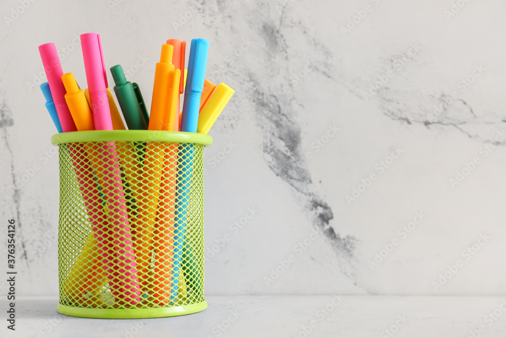 Colorful markers and pens on table