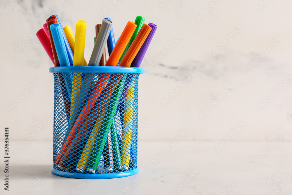 Many colorful markers on table