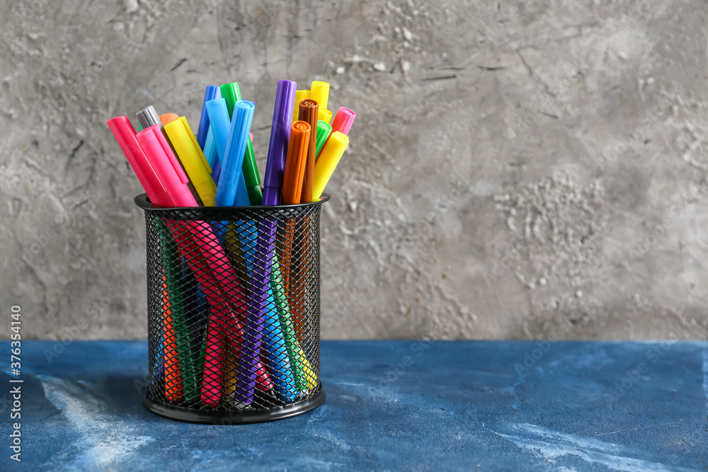 Set of different pens and markers on table