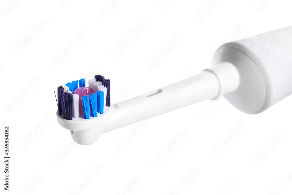 Electric tooth brush on white background, closeup