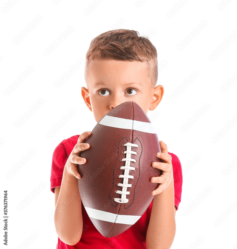 Little boy with rugby ball on white background