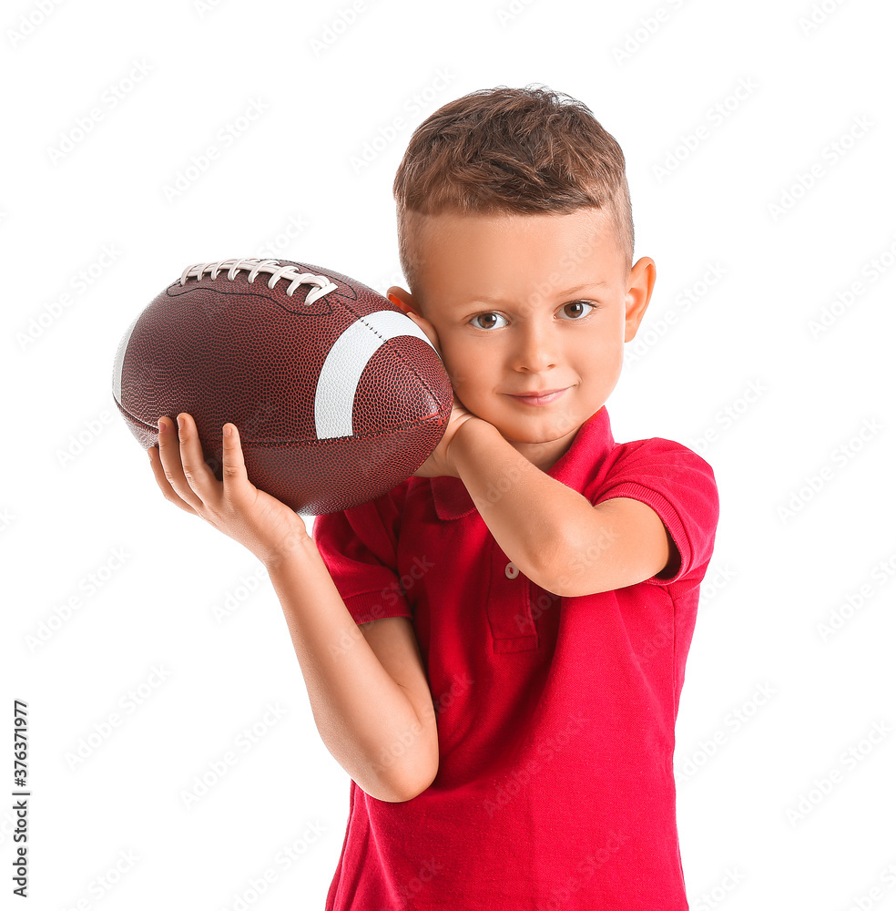 Little boy with rugby ball on white background