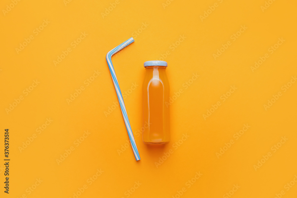 Bottle of juice on color background