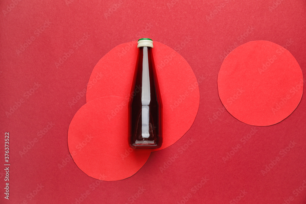 Bottle of juice on color background