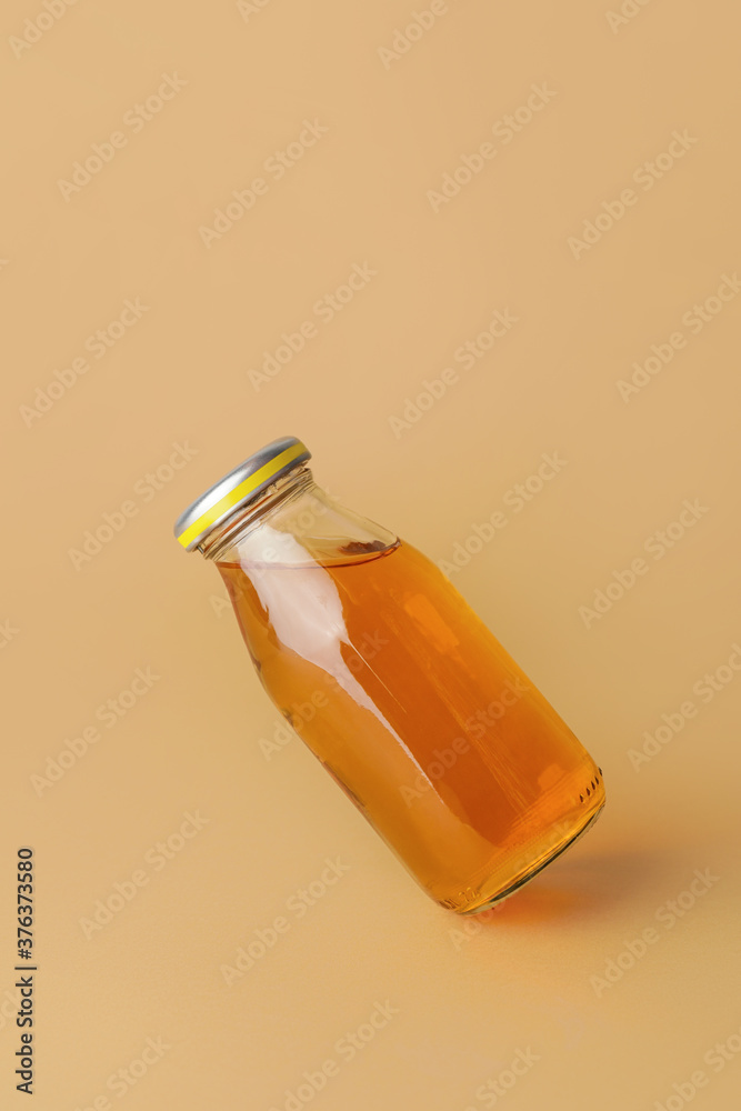 Bottle of juice on color background