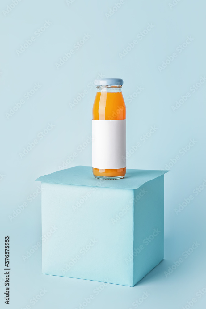 Bottle of juice on color background