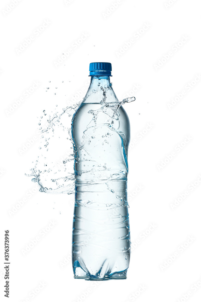 Bottle and splash of water on white background