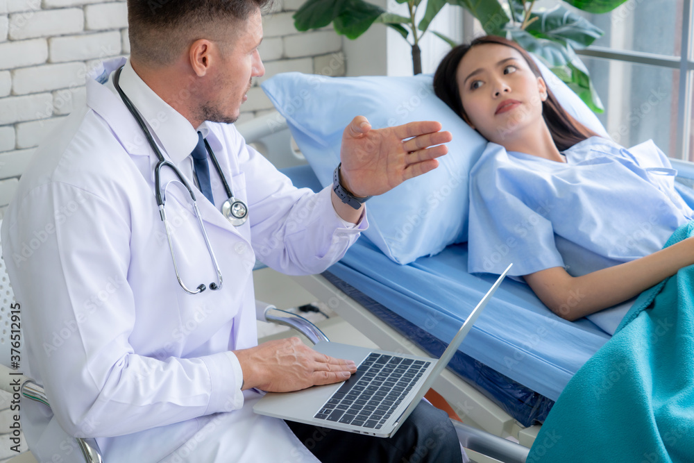 Doctor in professional uniform examining patient at hospital or medical clinic. Health care , medica