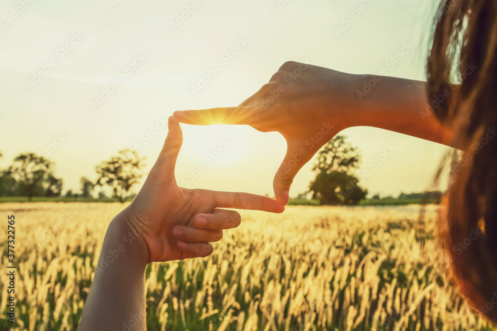 people make hand framing looking distant view