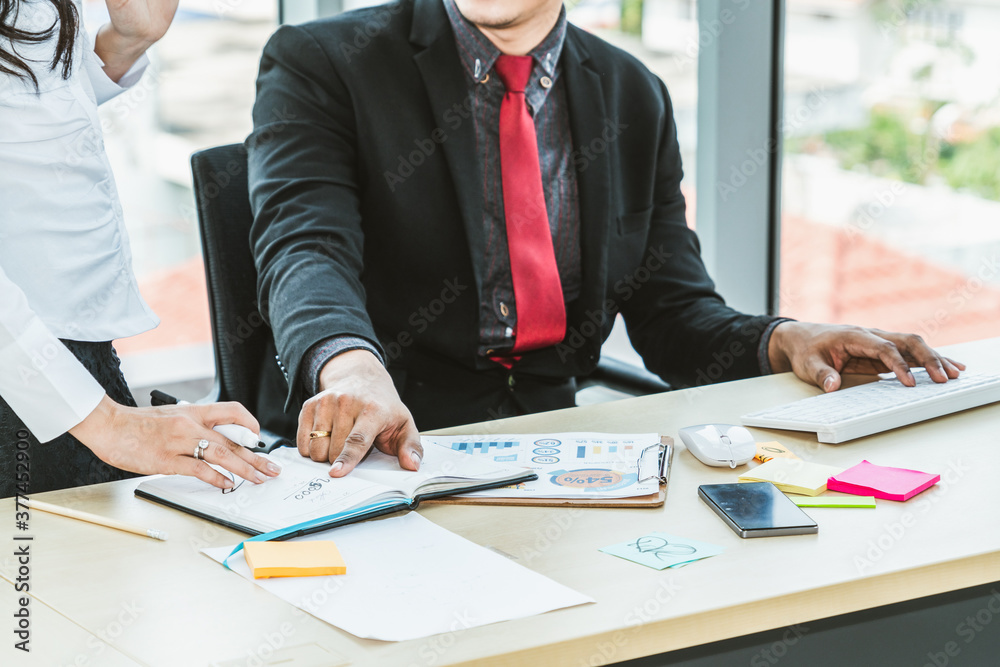 Two business people talk project strategy at office meeting room. Businessman discuss project planni