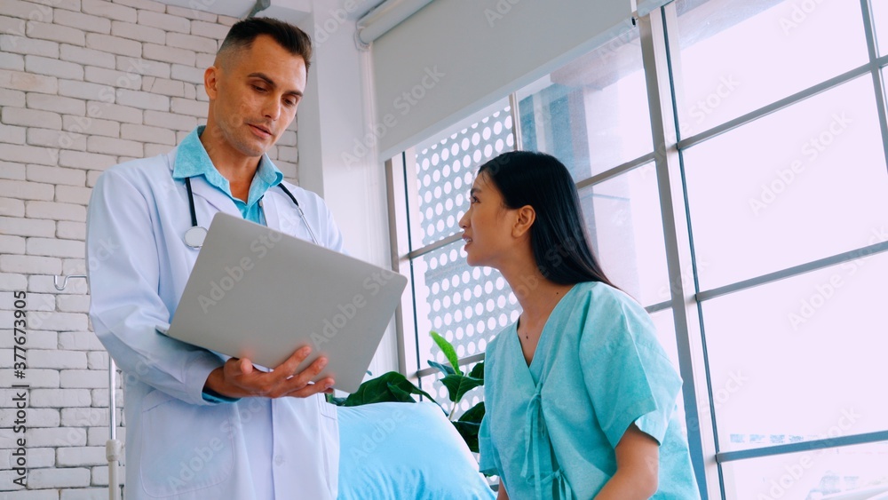 Doctor in professional uniform examining patient at hospital or medical clinic. Health care , medica