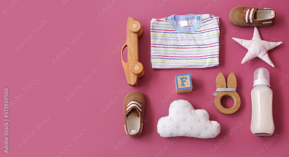 Set of baby accessories on color background