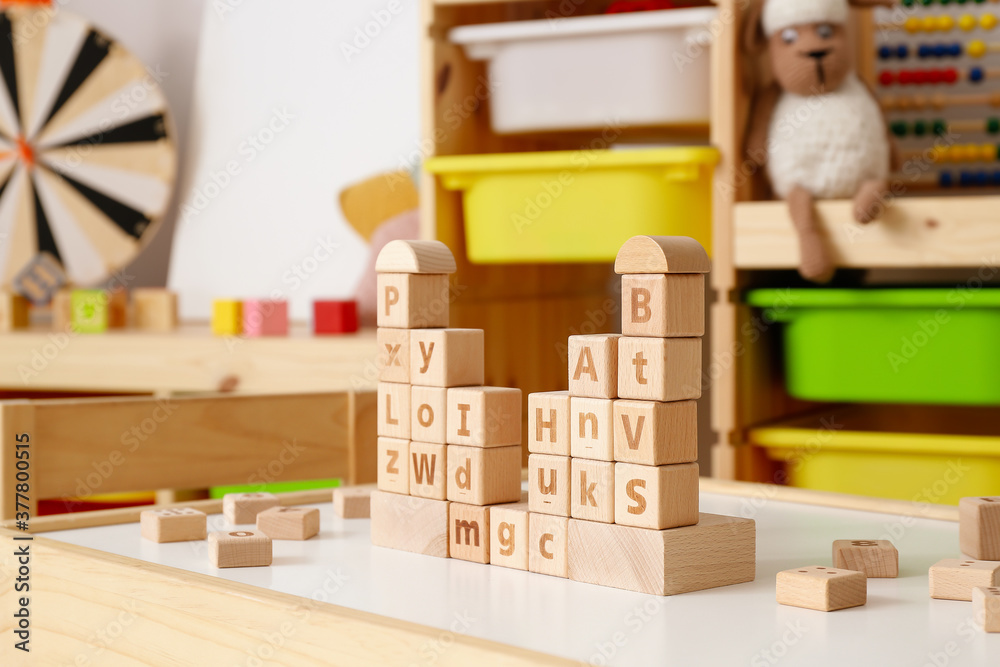 Wooden cubes on table in childrens room