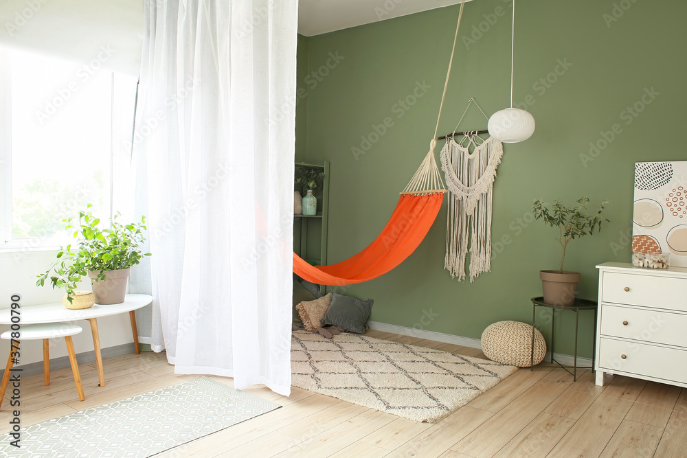 Interior of living room with stylish hammock