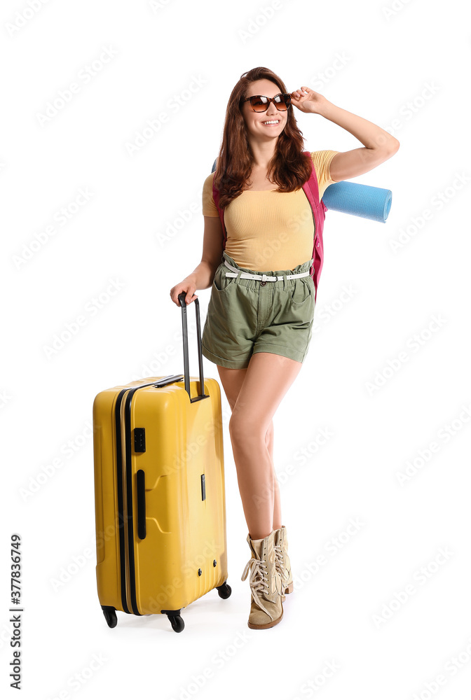 Female tourist with luggage on white background