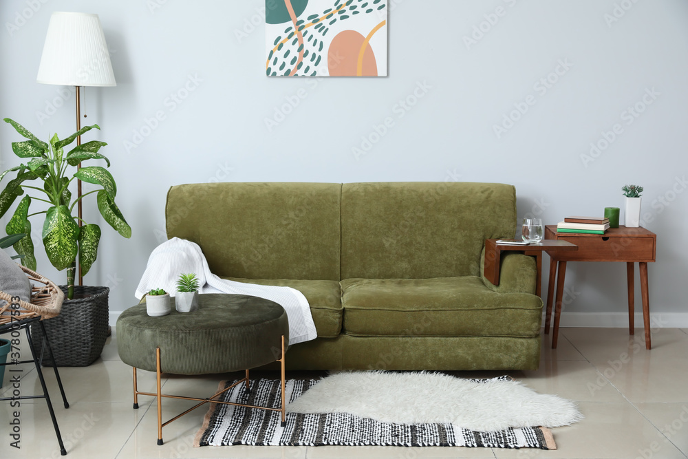 Armrest table on sofa in interior of room