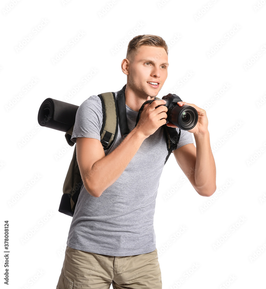 Male tourist with camera on white background