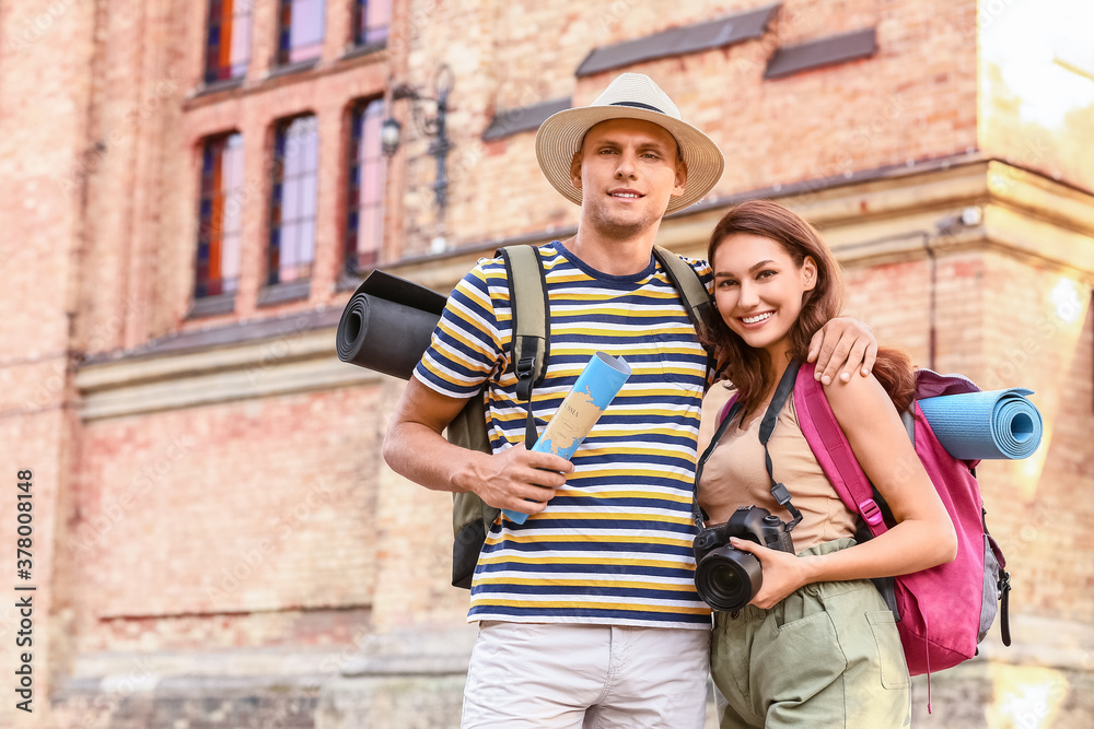 Couple of tourists on city street