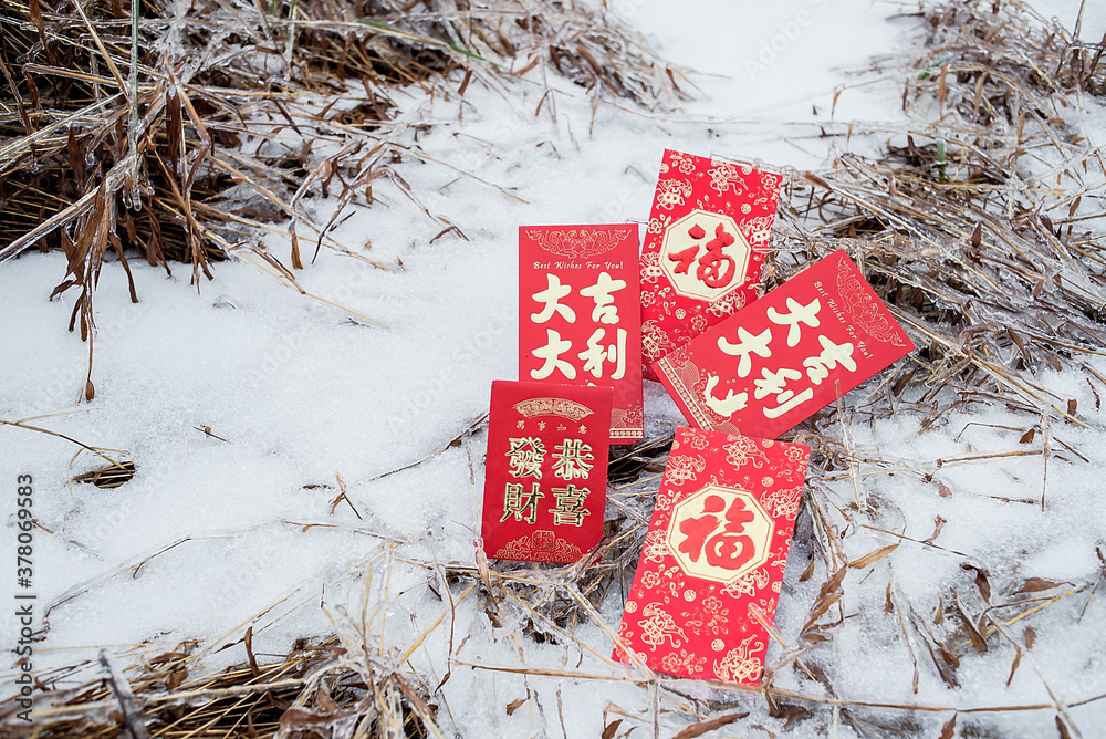 New Year red envelopes on the snow/Chinese New Year background