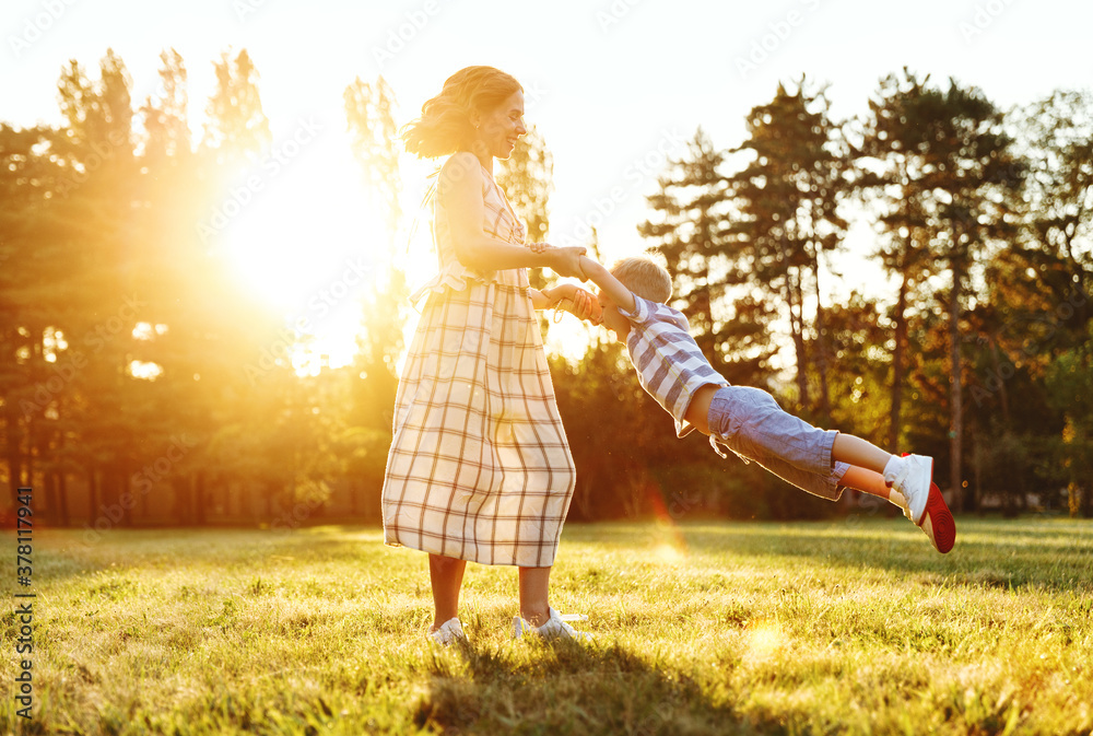 Happy family: mother and son in nature in summer.