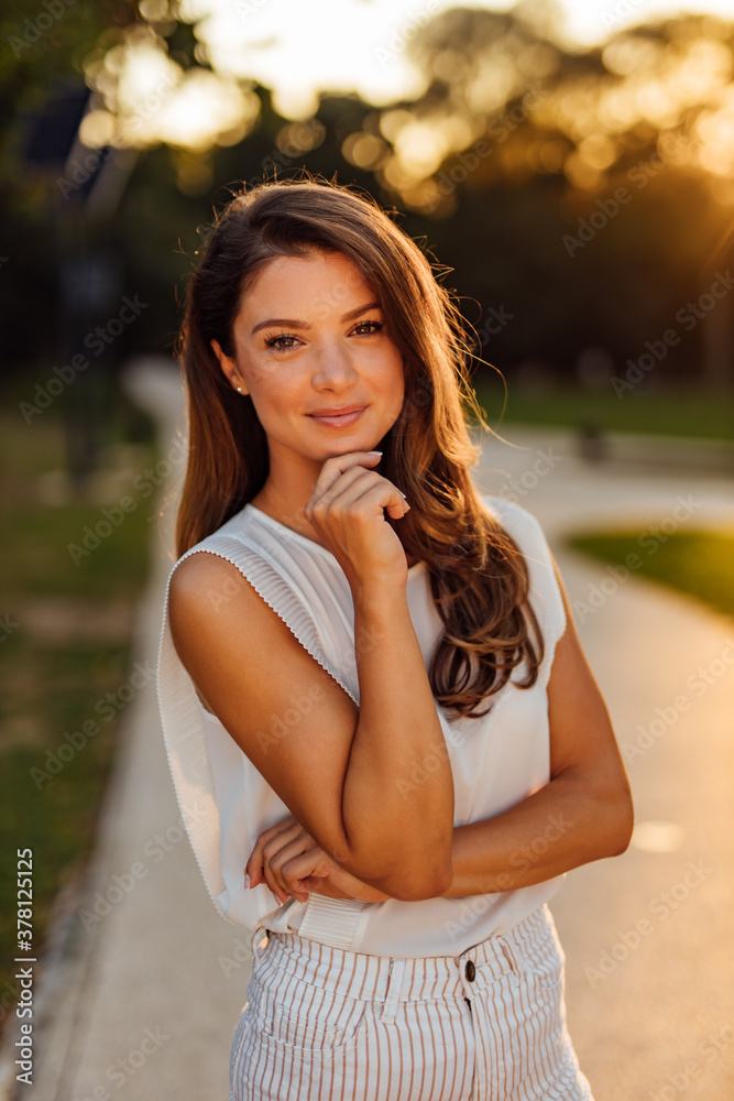 Brunette girl dressed in white.