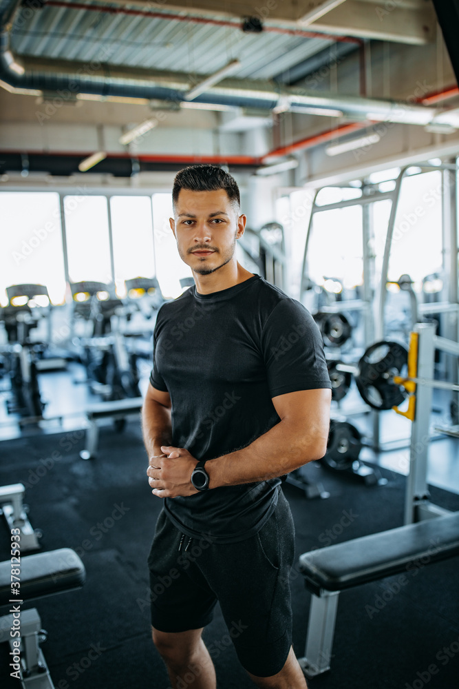 Posing for picture, at gym.