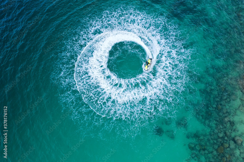 People are playing a jet ski in the sea.Aerial view. Top view.amazing nature background. The color o