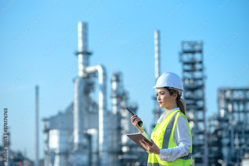 Engineer inspecting in industrial oil refinery. Industry 4.0 concept. Background blurred concept.